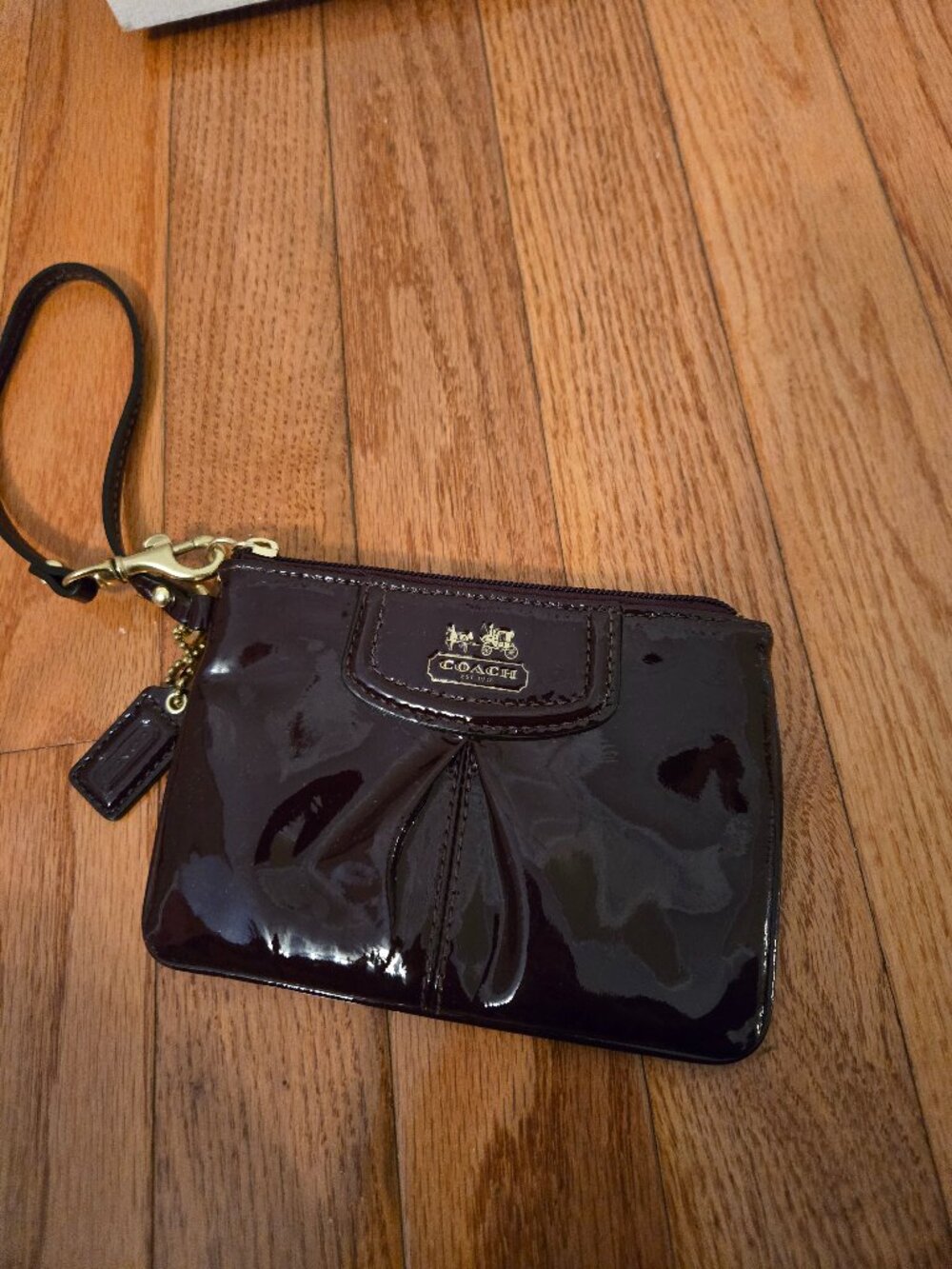 Gently used Coach Dark purple/maroon wristlet